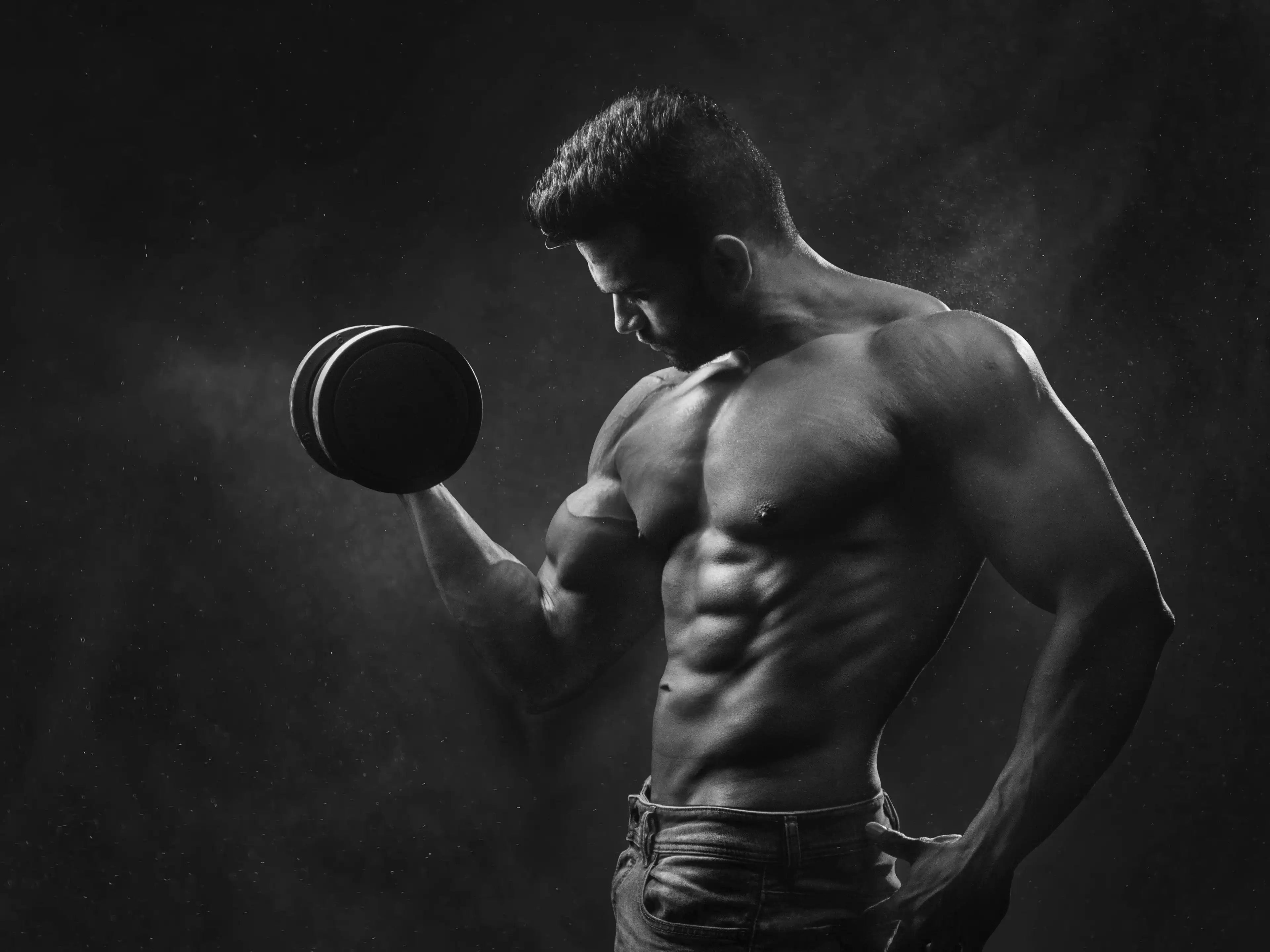 Bodybuilder holding a dumbbell with strong grip strength